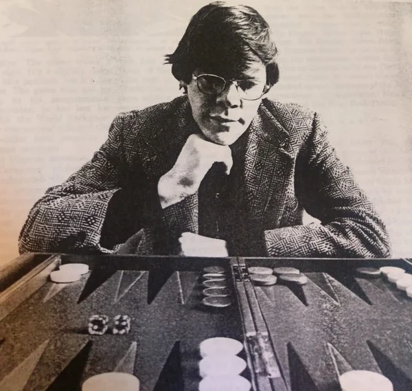 Paul Magriel in 1978, seated behind a backgammon board with his chin resting on his hand, photographed for Gambling Times magazine
